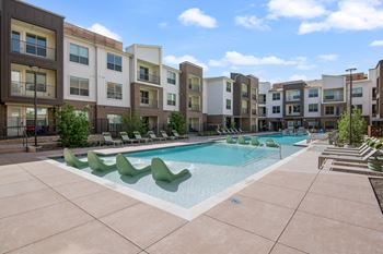 Resort-inspired pool with sundeck and fireside retreat